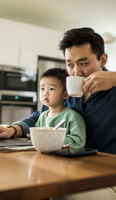 father using laptop